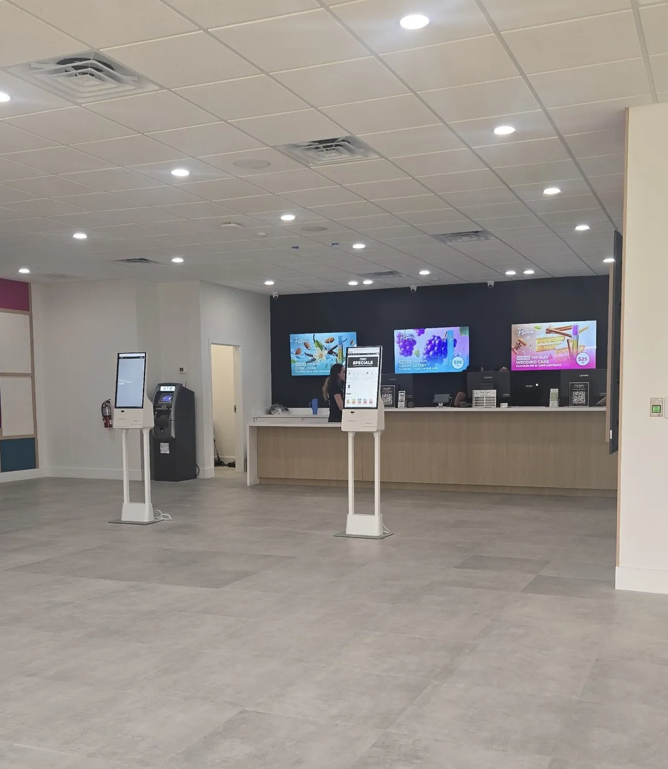 The open retail floor of RWB Brandon with display screens and kiosks